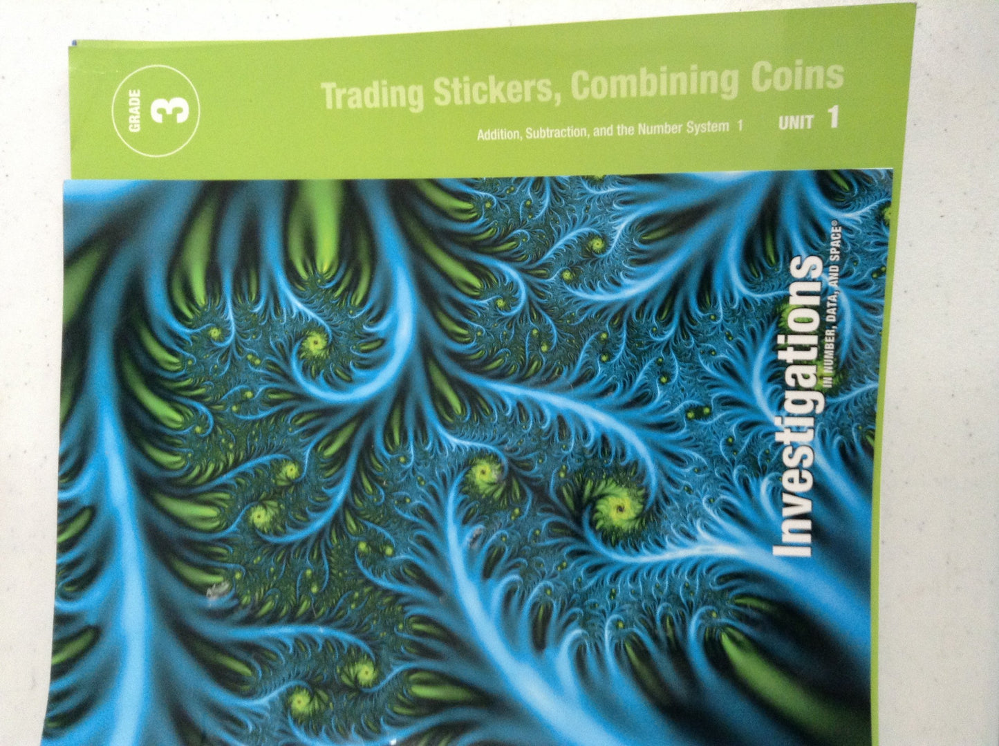 Trading stickers, Combining Coins: Addition, Subtraction, and the Number System 1, Grade 3, Unit 1, Teacher's Edition — ISBN 9780328600205